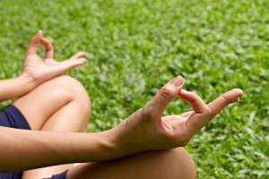 13750212-yoga-hand-of-meditation-isolated-on-green-field